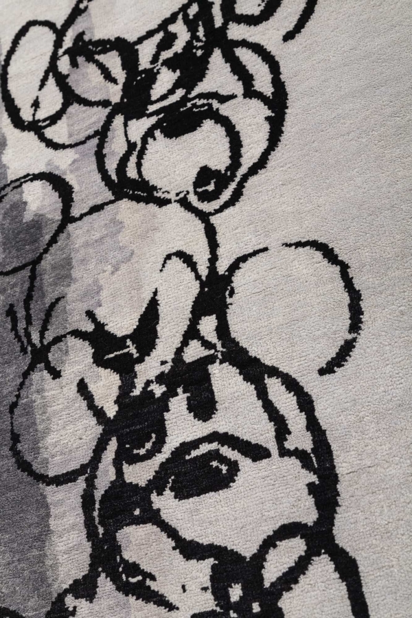Several Mickey Characters along one Edge Rug at Essie Carpets, Mayfair London